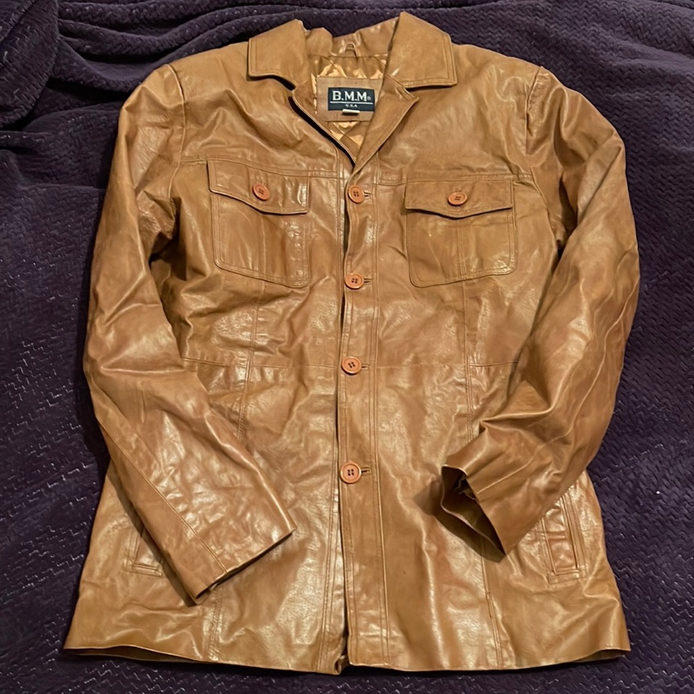 100% Brown Leather Jacket with 100% diamond stitched polyester lining.